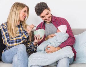 Loving parent comforting baby with formula