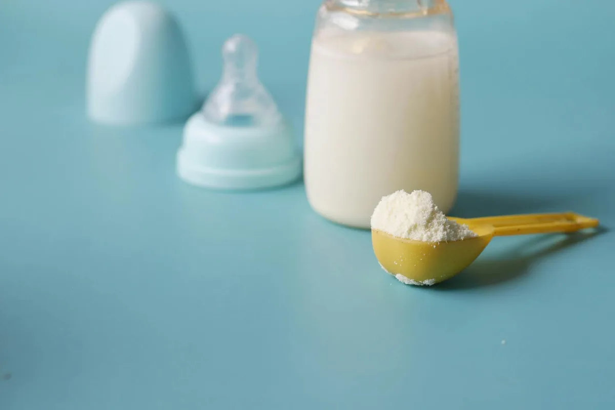 Baby bottles and formula on counter