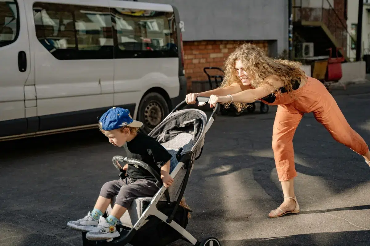 Toddler resisting stroller