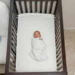 When can baby sleep with a blanket